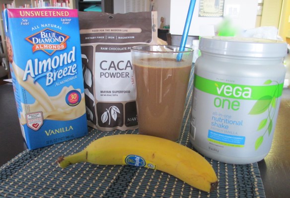 To make the smoothie - 1 1/2 cups unsweetened vanilla almond milk, 2 tablespoons raw cacao powder, 1 scoop French vanilla Vega One, 1 banana. Blend with a handful of ice until smooth.